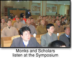 Monks and Scholars listen at the Symposium