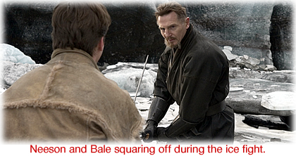 Neeson and Bale squaring off during the ice fight